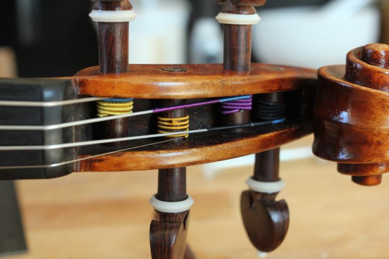 change violin strings pegbox